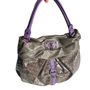 Large Marc Jacobs monograph puttering magnetic closure silver hardware.